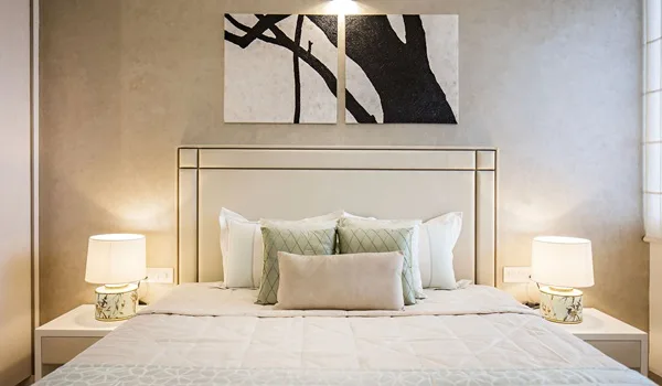 Master bedroom interior with wardrobe and balcony access in a Sobha Amara apartment